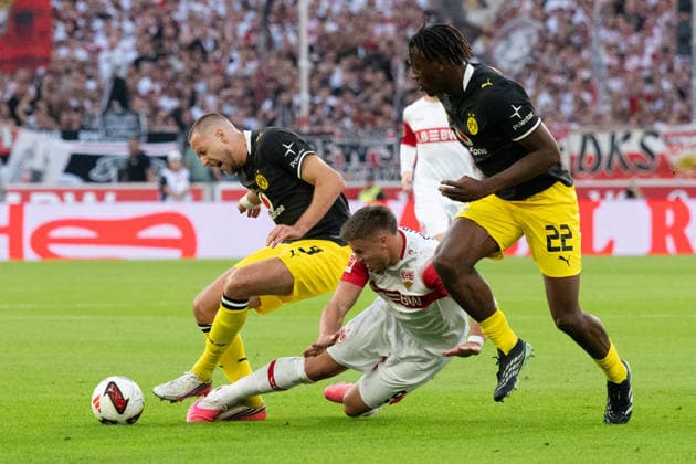 September 19, 2026, GER, Soccer, Men s, 1. Bundesliga, 2026–2027 Season, Matchday 4, VfB Stuttgart vs. Borussia Dortmund; from left, Waldemar Anton (Borussia Dortmund) in a tackle, 03, Ermedin Demirovic (VfB Stuttgart), 09, right: Joane Gadou (Borussia Dortmund), 22. DFB and DFL regulations prohibit any use of photographs as image sequences and or quasi-video. Stuttgart MHP Arena, Baden-Württemberg, Germany Copyright: xNordphoto WolfgangxFrankx