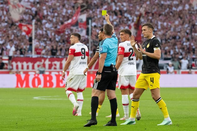 September 19, 2026, GER, Soccer, Men s, 1. Bundesliga, 2026–2027 Season, Matchday 4, VfB Stuttgart vs. Borussia Dortmund: Referee Tobias Stieler shows Ermedin Demirovic (VfB Stuttgart, No. 09) a yellow card after a foul on Waldemar Anton (Borussia Dortmund, No. 03), photo by Nico Schlotterbeck (Borussia Dortmund), 04 DFB and DFL regulations prohibit any use of photographs as image sequences and or quasi-video. Stuttgart MHP Arena, Baden-Württemberg, Germany Copyright: xNordphoto WolfgangxFrankx