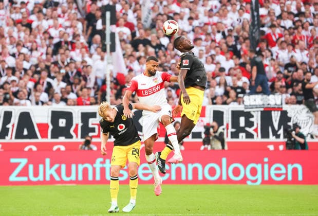 September 19, 2026, Germany, Stuttgart, Bundesliga, VfB Stuttgart vs. Borussia Dortmund, from left: Daniel Svensson (BVB), Josha Vagnoman (VfB), Serhou Guirassy (BVB)