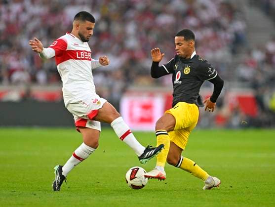 September 19, 2026, Soccer, Bundesliga 1, 2026–2027, Matchday 4, VfB Stuttgart vs. Borussia Dortmund, at the MHP Arena in Stuttgart, from left: Deniz Undav (Stuttgart) vs. Ethan Nwaneri (Borussia Dortmund)