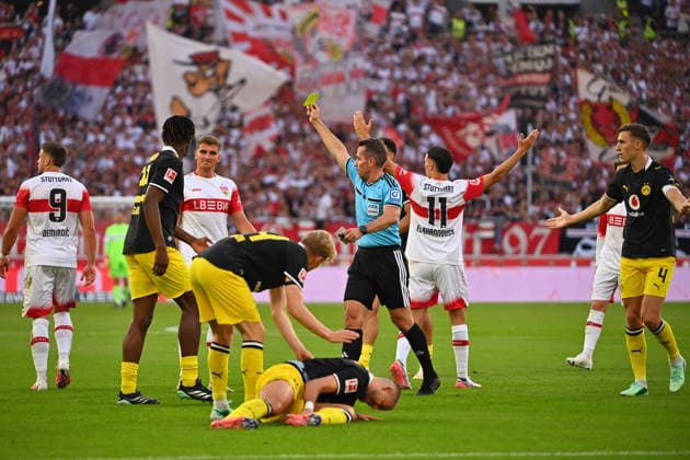 Warning, Yellow Card: Ermedin DEMIROVIC (VFB Stuttgart) for a foul on Ramy BENSEBAINI (Borussia Dortmund), Soccer, Bundesliga, 2026–2027 Season, Matchday 4, Matchday 04, VfB Stuttgart vs. Borussia Dortmund on September 19, 2026, MHP ARENA