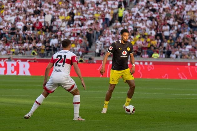 September 19, 2026: Soccer—VfB Stuttgart vs. Borussia Dortmund, Matchday 4 of the 1. Bundesliga at the MHP Arena: Felix Nmecha (Borussia Dortmund), 8 vs. Grischa Promel (VfB Stuttgart), 21 IMPORTANT NOTICE: In accordance with DFL and DFB regulations, it is prohibited to use or allow the use of photographs taken in the stadium and or during the game in the form of sequential images and or video-like photo sequences. Copyright: xJamesxZabelx