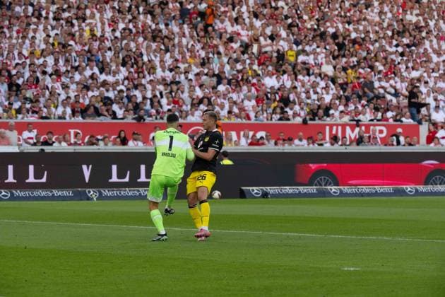 September 19, 2026: Soccer – VfB Stuttgart vs. Borussia Dortmund, Matchday 4 of the Bundesliga 1 at the MHP Arena; Fabian Bredlow (VfB Stuttgart), 1 VS Julian Ryerson, Borussia Dortmund, 26 IMPORTANT NOTICE: In accordance with DFL and DFB regulations, it is prohibited to use or allow the use of photographs taken in the stadium and or during the game in the form of sequential images and or video-like photo series. Copyright: xJamesxZabelx