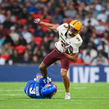 Kansas Jayhawks v Arizona State Sun Devils Union Jack Classic Corey Gordon, Safety of Kansas Jayhawks tackles Reed Harris, Wide Receiver of Arizona State Sun Devils during the Union Jack Classic match at Wembley Stadium, London 19 09 2026 UK Newspapers OUT Copyright: xMalcolmxFellx FIL-23969-0024