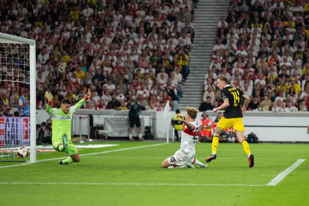 September 19, 2026, Germany, Soccer, Men s, 1. Bundesliga, 2026–2027 season, Matchday 4, VfB Stuttgart vs. Borussia Dortmund; goal making it 0–1 by Maximilian Beier (Borussia Dortmund), 14, left: Fabian Bredlow (VfB Stuttgart), 01, Finn Jeltsch (VfB Stuttgart), 29. DFB and DFL regulations prohibit any use of photographs as image sequences and or quasi-video. Stuttgart MHP Arena, Baden-Württemberg, Germany Copyright: xNordphoto WolfgangxFrankx