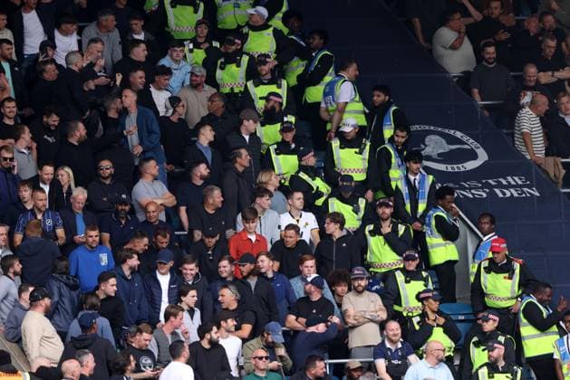 Police next to Millwall fans at the Millwall v West Ham EFL Championship match at The New Den. Millwall v West Ham United, EFL Sky Bet Championship, Football, The Den, London, UK - 19 Sep 2026London The Den United Kingdom EDITORIAL USE ONLY No use with unauthorised audio, video, data, fixture lists, club league logos or live services. Online in-match use limited to 120 images, no video emulation. No use in betting, games or single club league player publications. Paul M Copyright: xPaulxMarriott Shutterstockx 17158320cn