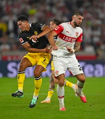 September 19, 2026, Soccer, Bundesliga 1, 2026–2027, Matchday 4, VfB Stuttgart vs. Borussia Dortmund, at the MHP Arena in Stuttgart, from left: Jobe Bellingham (Borussia Dortmund) vs. Jeff Chabot (Stuttgart)