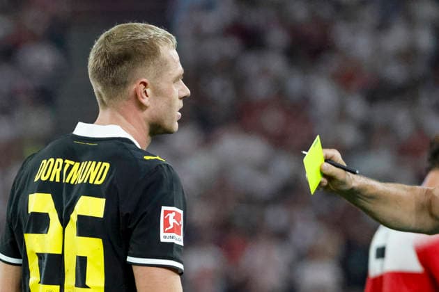 Julian Ryerson of BVB Dortmund, age 26, receives a yellow card from referee Tobias Stieler, Germany, soccer, Bundesliga 1, Matchday 4, 2026–2027, VfB Stuttgart vs. Borussia Dortmund, September 19, 2026, Stuttgart MHP Arena, Germany Copyright: xGrantxHubbsx