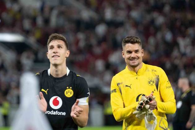 September 19, 2026: Soccer – VfB Stuttgart vs. Borussia Dortmund, Matchday 4 of the Bundesliga at the MHP Arena: Nico Schlotterbeck (Borussia Dortmund, No. 4) and Alexander Meyer (Borussia Dortmund, No. 33) celebrating after the final whistle in front of the Dortmund Kurve IMPORTANT NOTICE: In accordance with DFL and DFB regulations, it is prohibited to use or allow the use of photographs taken in the stadium and or during the game in the form of sequential images and or video-like photo sequences Copyright: xJamesxZabelx