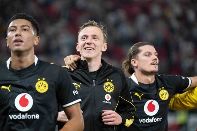 September 19, 2026: Soccer—VfB Stuttgart vs. Borussia Dortmund, Matchday 4 of the Bundesliga 1 at the MHP Arena: Maximilian Beier of Borussia Dortmund, No. 14, celebrating after the final whistle in front of the Dortmund fan section. IMPORTANT NOTICE: In accordance with the regulations of the DFL and the DFB, it is prohibited to use or allow the use of photographs taken in the stadium and or during the game in the form of sequential images and or video-like photo series. Copyright: xJamesxZabelx