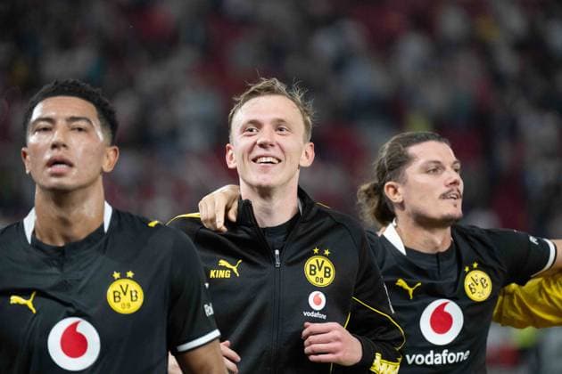 September 19, 2026: Soccer—VfB Stuttgart vs. Borussia Dortmund, Matchday 4 of the Bundesliga 1 at the MHP Arena: Maximilian Beier of Borussia Dortmund, No. 14, celebrating after the final whistle in front of the Dortmund fan section. IMPORTANT NOTICE: In accordance with the regulations of the DFL and the DFB, it is prohibited to use or allow the use of photographs taken in the stadium and or during the game in the form of sequential images and or video-like photo series. Copyright: xJamesxZabelx