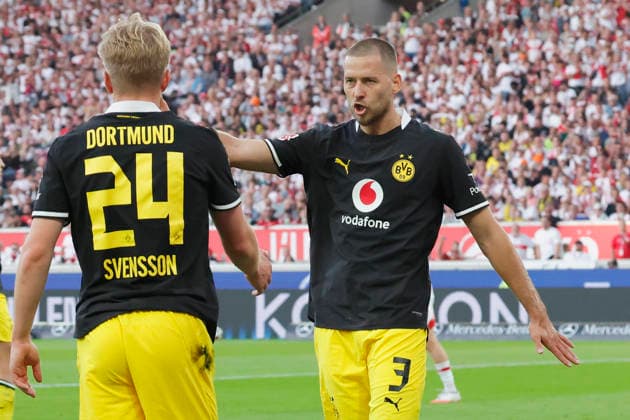Pictured from left: Daniel Svensson of Borussia Dortmund, 24, and Waldemar Anton of Borussia Dortmund, 3, celebrate after a successful play on September 19, 2026, VfB Stuttgart vs. Borussia Dortmund, Bundesliga 1, Matchday 4, Germany, Stuttgart, MHP Arena. DFL regulations prohibit any use of photographs as image sequences and or quasi-video. Copyright: HMBxMedia xJulienxBecker