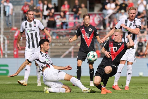 September 19, 2026, xsefx, Soccer, FC Viktoria Köln vs. FC Ingolstadt 04, 3. Liga, Sportpark Höhenberg, Matchday 7, 2026–2027 Season: Lukas Fröde (FC Ingolstadt 04, No. 34) in a tackle against Tim Kloss (FC Viktoria Köln, No. 18). DFB regulations prohibit any use of photographs as image sequences and or quasi-video. North Rhine-Westphalia, Germany