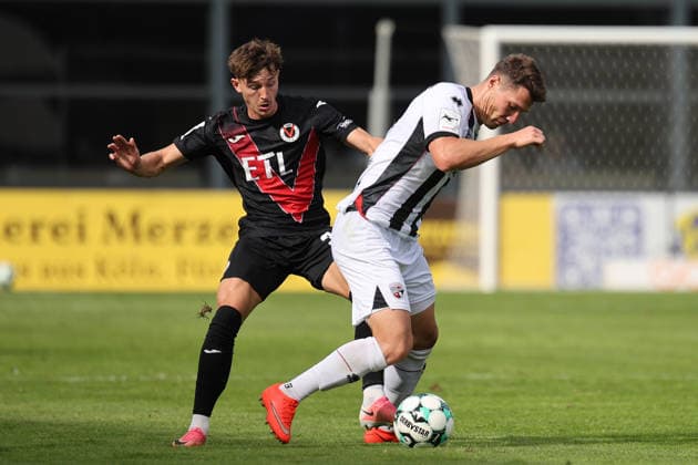 September 19, 2026, xsefx, Soccer, FC Viktoria Köln vs. FC Ingolstadt 04, 3. Liga, Sportpark Höhenberg, Matchday 7, 2026–2027 Season: Jonas Scholz (FC Ingolstadt 04, No. 15) in a tackle against Alexander Prokopenko (FC Viktoria Köln, No. 30). DFB regulations prohibit any use of photographs as image sequences and or quasi-video. North Rhine-Westphalia, Germany