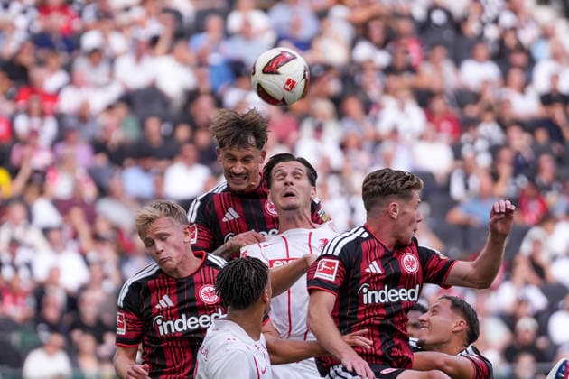 Robin Koch, Eintracht Frankfurt, 04, Jonathan Burkardt, Eintracht Frankfurt, 09, in a tackle with Igor Matanovic, SC Freiburg, 31, Germany, soccer, Bundesliga 1, Matchday 4, 2026–2027, Eintracht Frankfurt vs. SC Freiburg, September 19, 2026, Deutsche Bank Park, Frankfurt, Hesse, Germany Copyright: xArnexAmbergx