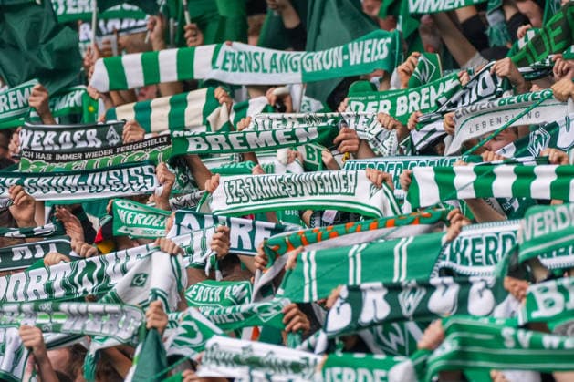 Werder fans hold scarves aloft, 125 Years of Werder lettering, stock photo, German soccer, Bundesliga, 2026–27 season, Matchday 4, September 19, 2026, Werder Bremen vs. FC Augsburg, Weserstadion, Bremen Copyright: xLeonxFrickx