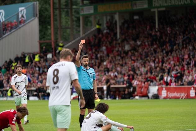 September 20, 2026: Energie Cottbus vs. FC St. Pauli, Matchday 6 of the 2. Bundesliga at the LEAG Energie Stadium; Yellow-red card for Tomoya Ando (FC St. Pauli), 15 IMPORTANT NOTICE: In accordance with DFL and DFB regulations, it is prohibited to use or allow the use of photographs taken in the stadium and or during the game in the form of sequential images and or video-like photo series. Copyright: xJamesxZabelx
