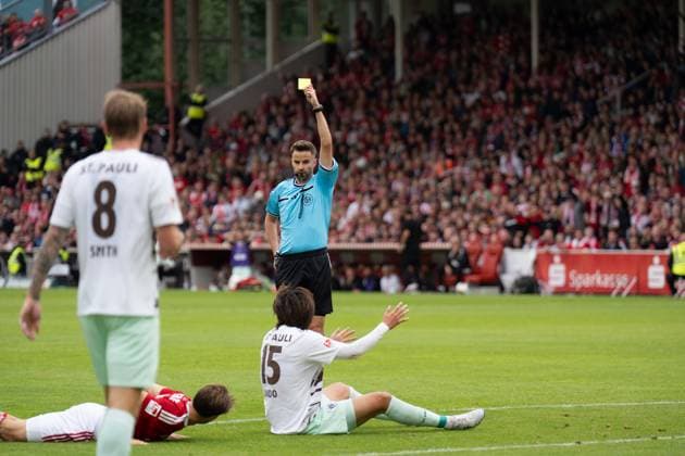 September 20, 2026: Energie Cottbus vs. FC St. Pauli, Matchday 6 of the 2. Bundesliga at the LEAG Energie Stadium; Yellow-red card for Tomoya Ando (FC St. Pauli), 15 IMPORTANT NOTICE: In accordance with DFL and DFB regulations, it is prohibited to use or allow the use of photographs taken in the stadium and or during the game in the form of sequential images and or video-like photo series. Copyright: xJamesxZabelx