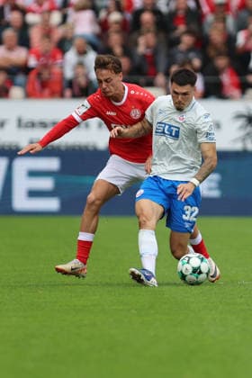 Essen, Germany, September 20, 2026, 3. Liga 2026–2027, Matchday 7: Rot-Weiss Essen vs. FC Hansa Rostock. Pictured from left in a tackle: Marvin Obuz (RWE) and Niklas Kölle (FCH). DFB and DFL regulations prohibit any use of photographs as image sequences and or quasi-video Stadion an der Hafenstraße, North Rhine-Westphalia Copyright: xFotostandx xFWMEDIAx