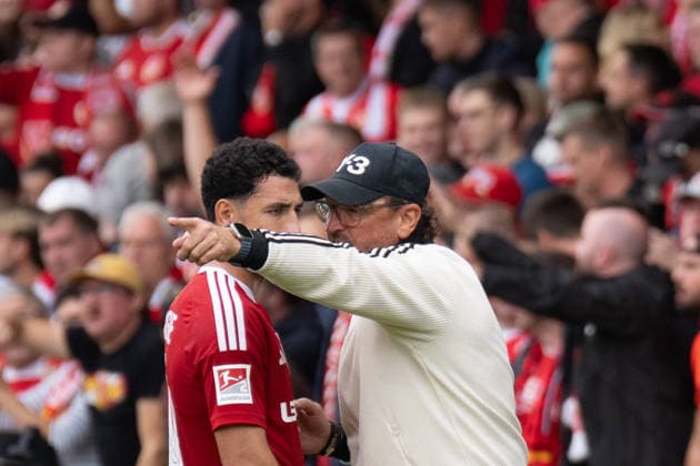 September 20, 2026: Energy Cottbus vs. FC St. Pauli, Matchday 6 of the 2. Bundesliga at the LEAG Energie Stadium. Claus Dieter Wollitz, coach of Energy Cottbus, in conversation with Tolcay Cigerci of Energy Cottbus, 10 IMPORTANT NOTICE: In accordance with DFL and DFB regulations, it is prohibited to use or allow the use of photographs taken in the stadium and or during the game in the form of sequential images and or video-like photo series. Copyright: xJamesxZabelx