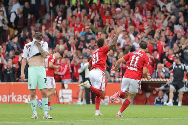 Goal scorer No. 31 Justin Butler of Energie Cottbus and No. 11 Moritz Hannemann of Energie Cottbus celebrate the 1-0 victory for Cottbus in the 2026-2027 2. Bundesliga season: FC Energie Cottbus vs. FC St. Pauli