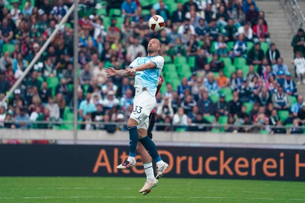 Germany Soccer 2. Bundesliga 2026–2027, Matchday 6: Hannover 96 vs. VfL Bochum at Heinz von Heiden Arena Stadium in Hannover; aerial duel involving Philipp Hofmann of VfL Bochum, No. 33 Copyright: xAymanxAlahmedx