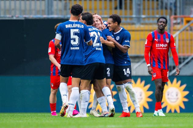 September 20, 2026 Soccer, 2026–2027, 2. Bundesliga, Matchday 6, DSC Arminia Bielefeld 1 FC Heidenheim. M Felix Hagmann of Bielefeld celebrates his goal to tie the game at 2–2, surrounded by a group of teammates, including (L–R) Maximilian Bauer of Bielefeld, Stefano Russo (Bielefeld), Monju Momuluh (Bielefeld). DFL regulations prohibit any use of photographs as image sequences and or quasi-video.