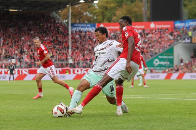 September 20, 2026, xtgx, Soccer 2. Bundesliga, FC Energie Cottbus vs. FC St. Pauli, from left: Joel Chima Fujita (St. Pauli), 16, King Manu (Cottbus), 2 Tackle, duel, battle, DFL and DFB regulations prohibit any use of photographs as image sequences and or quasi-video, Cottbus