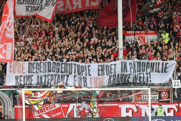 September 20, 2026, xtgx, Soccer 2. Bundesliga, FC Energie Cottbus vs. FC St. Pauli, from left: stock photo, stock image, fans, spectators, audience, Grandstand banner: Your rainbow utopia ends in pedophilia. No acceptance for your sick world. DFL DFB REGULATIONS PROHIBIT ANY USE OF PHOTOGRAPHS as IMAGE SEQUENCES and or QUASI-VIDEO. Cottbus