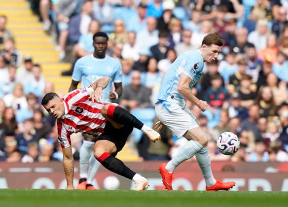 Manchester, England, 20th September 2026. Granit Xhaka of Sunderland tussles with Elliot Anderson of Manchester City during the Manchester City vs Sunderland Premier League match at the Etihad Stadium, Manchester. Picture credit should read: Andrew Yates Sportimage EDITORIAL USE ONLY. No use with unauthorised audio, video, data, fixture lists, club league logos or live services. Online in-match use limited to 120 images, no video emulation. No use in betting, games or single club league player publications. SPI_021_AY_ManCity_Sunderland SPI-5012-0021