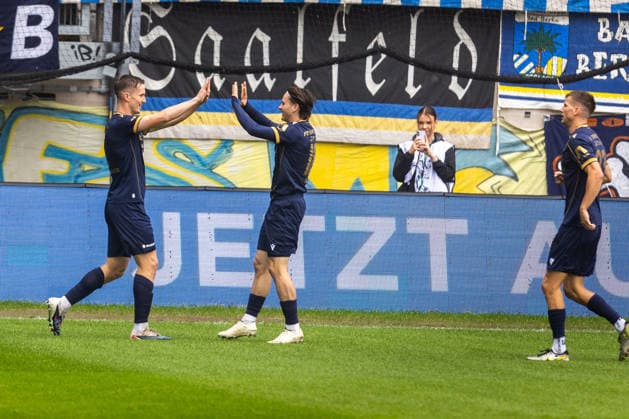 Jena, June 26, 2009, Regional League Soccer, FC Carl Zeiss vs. Lok Leipzig; pictured: Luca Wollschläger and Elias Löder; Jena celebrates the goal that made it 1–0