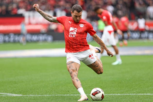 David Raum of RB Leipzig warming up during the Bundesliga match between Bayer 04 Leverkusen and RB Leipzig, BayArena on September 20, 2026, in Leverkusen, Germany. Photo by Oliver Kaelke, DeFodi Images. David Raum of RB Leipzig warms up during the Bundesliga match between Bayer 04 Leverkusen and RB Leipzig at BayArena on September 20, 2026 in Leverkusen, Germany. Photo by Oliver Kaelke, DeFodi Images. DFB and DFL regulations prohibit any use of photographs as image sequences and or quasi-video. Photo by Oliver Kaelke, DeFodi Images