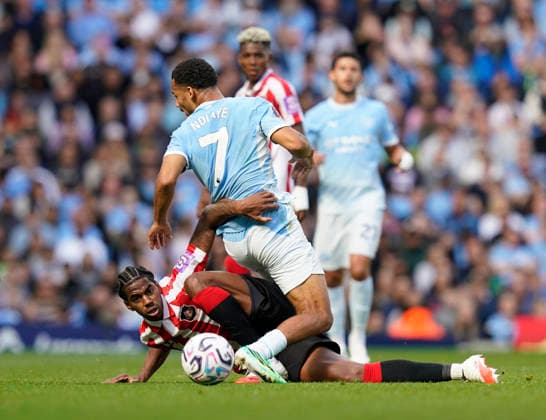 Manchester, England, 20th September 2026. Dayann Methalie of Sunderland tussles with Illiman Ndiaaye of Manchester City during the Manchester City vs Sunderland Premier League match at the Etihad Stadium, Manchester. Picture credit should read: Andrew Yates Sportimage EDITORIAL USE ONLY. No use with unauthorised audio, video, data, fixture lists, club league logos or live services. Online in-match use limited to 120 images, no video emulation. No use in betting, games or single club league player publications. SPI_039_AY_ManCity_Sunderland SPI-5012-0039