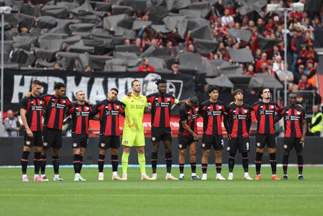 Bayer 04 Leverkusen players observing a minute of silence in honor of Peter Herrmann during the Bundesliga match between Bayer 04 Leverkusen and RB Leipzig, BayArena on September 20, 2026, in Leverkusen, Germany. Photo by Oliver Kaelke, DeFodi Images. Teams from Bayer 04 Leverkusen during the minute of silence in honor of Peter Herrmann during the Bundesliga match between Bayer 04 Leverkusen and RB Leipzig at BayArena on September 20, 2026 in Leverkusen, Germany. Photo by Oliver Kaelke, DeFodi Images. DFB and DFL regulations prohibit any use of photographs as image sequences and or quasi-video. Photo by Oliver Kaelke, DeFodi Images.