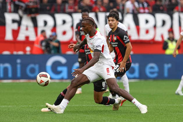 Ezechiel Banzuzi of RB Leipzig and Equi Fernandez of Bayer 04 Leverkusen battle for the ball during the Bundesliga match between Bayer 04 Leverkusen and RB Leipzig at BayArena on September 20, 2026, in Leverkusen, Germany. Photo by Oliver Kaelke, DeFodi Images. Ezechiel Banzuzi of RB Leipzig and Equi Fernandez of Bayer 04 Leverkusen battle for the ball during the Bundesliga match between Bayer 04 Leverkusen and RB Leipzig at BayArena on September 20, 2026 in Leverkusen, Germany. Photo by Oliver Kaelke, DeFodi Images. DFB and DFL regulations prohibit any use of photographs as image sequences and or quasi-video. Photo by Oliver Kaelke, DeFodi Images