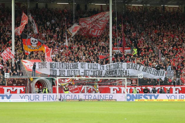 September 20, 2026, xtgx, Soccer 2. Bundesliga, FC Energie Cottbus vs. FC St. Pauli, from left: stock photo, stock image, stock photo of fans, spectators, audience, Grandstand, banner, Your detachment from reality is almost unbearable—break up the old guard and smash the Alerta network. DFL DFB REGULATIONS PROHIBIT ANY USE OF PHOTOGRAPHS as IMAGE SEQUENCES and or QUASI-VIDEO. Cottbus