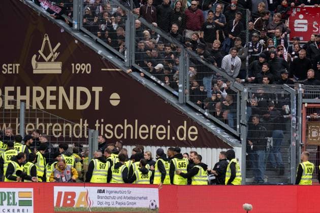 September 20, 2026: Energie Cottbus vs. FC St. Pauli, Matchday 6 of the 2. Bundesliga at the LEAG Energie Stadium: Security personnel and police presence next to the St. Pauli visitors’ section after the final whistle IMPORTANT NOTICE: In accordance with the guidelines of the DFL and the DFB, it is prohibited to to use or allow the use of photographs taken in the stadium and or during the game in the form of sequential images and or video-like photo series Copyright: xJamesxZabelx