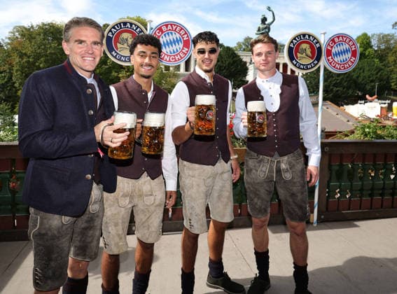 from left: Steffen FREUND, Nathaniel BROWN (M), Aleksandar PAVLOVIC (M), goalkeeper Jonas URBIG (M) — FC Bayern Munich soccer players — traditional Oktoberfest visit to the Kaefer Schaenke on September 20, 2026, in Munich, Germany Â