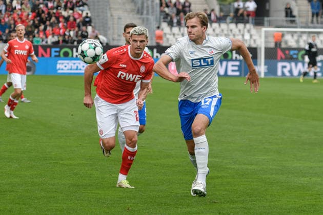 From left in a one-on-one situation: Marek Janssen (Essen), 20; Florian Carstens (Rostock), 17; 2009; 2026 ¢ Soccer ¢ Rot-Weiss Essen vs. Hansa Rostock, Essen Stadium, Essen, DFB DFL regulations prohibit any use of photographs as image sequences and or quasi-video. NRW, Germany Copyright: xpepphotox xSaschaxWeizx pep00321, pep_20260920_hm