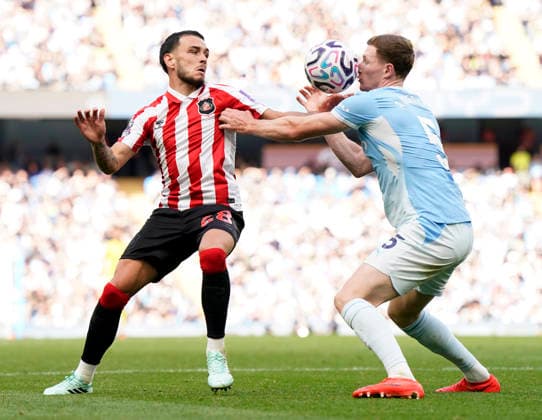 Manchester, England, 20th September 2026. Enzo Le Fee of Sunderland and Elliot Anderson of Manchester City during the Manchester City vs Sunderland Premier League match at the Etihad Stadium, Manchester. Picture credit should read: Andrew Yates Sportimage EDITORIAL USE ONLY. No use with unauthorised audio, video, data, fixture lists, club league logos or live services. Online in-match use limited to 120 images, no video emulation. No use in betting, games or single club league player publications. SPI_055_AY_ManCity_Sunderland SPI-5012-0055