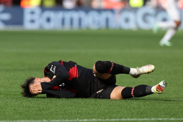 Afonso Moreira of Bayer 04 Leverkusen lies injured on the ground, gesturing, during the Bundesliga match between Bayer 04 Leverkusen and RB Leipzig, BayArena on September 20, 2026, in Leverkusen, Germany. Photo by Oliver Kaelke, DeFodi Images. Afonso Moreira of Bayer 04 Leverkusen is injured on the ground and gesturing during the Bundesliga match between Bayer 04 Leverkusen and RB Leipzig at BayArena on September 20, 2026 in Leverkusen, Germany. Photo by Oliver Kaelke, DeFodi Images. DFB and DFL regulations prohibit any use of photographs as image sequences and or quasi-video. Photo by Oliver Kaelke, DeFodi Images.