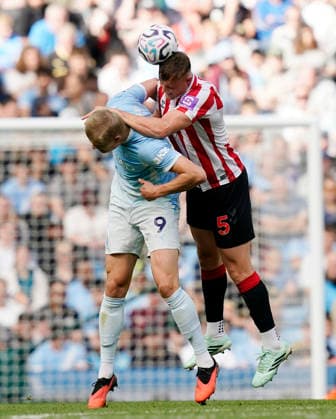 Manchester, England, 20th September 2026. Erling Haaland of Manchester City challenged by Daniel Ballard of Sunderland during the Manchester City vs Sunderland Premier League match at the Etihad Stadium, Manchester. Picture credit should read: Andrew Yates Sportimage EDITORIAL USE ONLY. No use with unauthorised audio, video, data, fixture lists, club league logos or live services. Online in-match use limited to 120 images, no video emulation. No use in betting, games or single club league player publications. SPI_074_AY_ManCity_Sunderland SPI-5012-0073