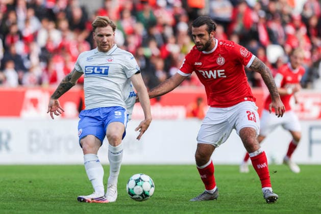 Soccer, 3rd Division, Matchday 7: Rot Weiss Essen vs. Hansa Rostock on September 20, 2026, at the Stadion an der Hafenstraße in Essen. Andreas Voglsammer (Rostock, left), José Enrique Ríos Alonso (Essen, right). DFB regulations prohibit any use of photographs as image sequences and or quasi-video. xJRx