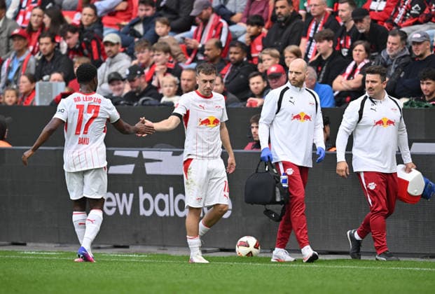 Brajan Gruda (RB Leipzig) injured; injury; Ridle Baku RB Leipzig celebrates; Soccer; Bundesliga 1, Matchday 4, Bayer 04 Leverkusen vs. RB Leipzig, on September 20, 2026, in Leverkusen, Germany. DFL regulations prohibit any use of photographs as image sequences and or quasi-video.