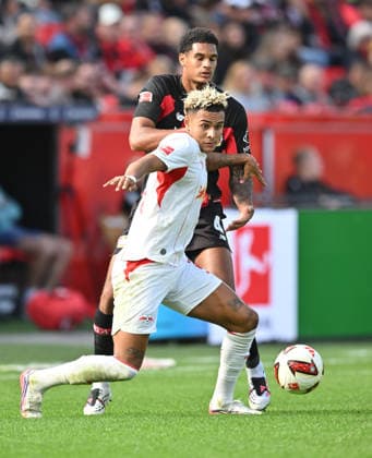 l r Jarell Quansah, Bayer Leverkusen; Antonio Nusa, RB Leipzig; Action, Tackle, Soccer, 1. Bundesliga, Matchday 4, Bayer 04 Leverkusen vs. RB Leipzig, on September 20, 2026, in Leverkusen, Germany. DFL regulations prohibit any use of photographs as image sequences and or quasi-video.