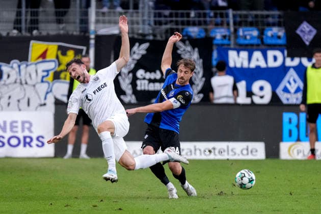From left: Philipp Maier (Münster), 26; Lukas Klünter (SV Waldhof), 24, captain; tackle, game scene, duel, tackle, tackling, dynamism, action, 20 09 2026, Mannheim, Germany, soccer, 3rd Division, SV Waldhof Mannheim vs. SC Preußen Münster, DFB and DFL regulations prohibit any use of photographs as image sequences and or quasi-video xozx