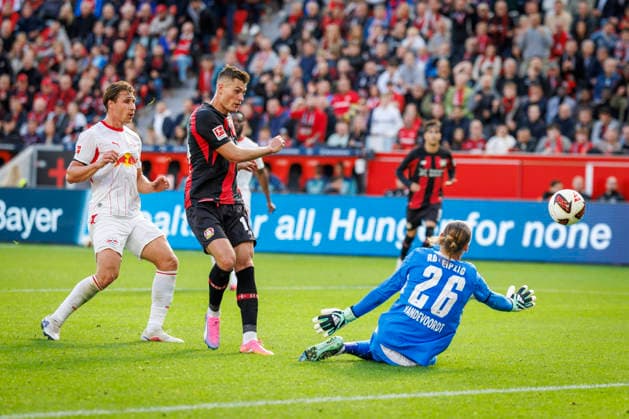 LEVERKUSEN, GERMANY - SEPTEMBER 20, 2026: Keeper Maarten Vandevoordt (RB Leipzig, 26) saves before Patrik Schick (Bayer 04 Leverkusen, 14) during the German Bundesliga match on gameday 4 between Bayer 04 Leverkusen vs. RB Leipzig at BayArena on September 20, 2026 in Leverkusen, Germany. DFL REGULATIONS PROHIBIT ANY USE OF PHOTOGRAPHS AS IMAGE SEQUENCES AND OR QUASI-VIDEO. Northrhine-Westphalia Germany Copyright: xAxelxKohringx