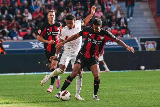 September 20, 2026, xjmrgnx, Soccer 1 Bundesliga, Bayer 04 Leverkusen vs. RB Leipzig: A tackle between Christopher Nkunku (28), Leipzig, and Jarell Quansah (4), Leverkusen. DFL and DFB regulations prohibit any use of photographs as image sequences and or quasi-video. Leverkusen