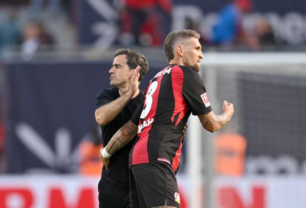 Coach Carles Martinez of Bayer Leverkusen and Robert Andrich of Bayer Leverkusen high-five each other after the game in Soccer 1 Bundesliga, Matchday 4, Bayer 04 Leverkusen vs. RB Leipzig, on September 20, 2026, in Leverkusen, Germany. DFL regulations prohibit any use of photographs as image sequences and or quasi-video.