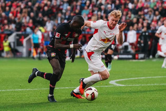 September 20, 2026, xjmrgnx, Soccer, Bundesliga 1, Bayer 04 Leverkusen vs. RB Leipzig: A tackle between Moussa Diaby (19), Leverkusen, and Nicolas Seiwald (13), Leipzig. DFL and DFB regulations prohibit any use of photographs as image sequences and or quasi-video. Leverkusen